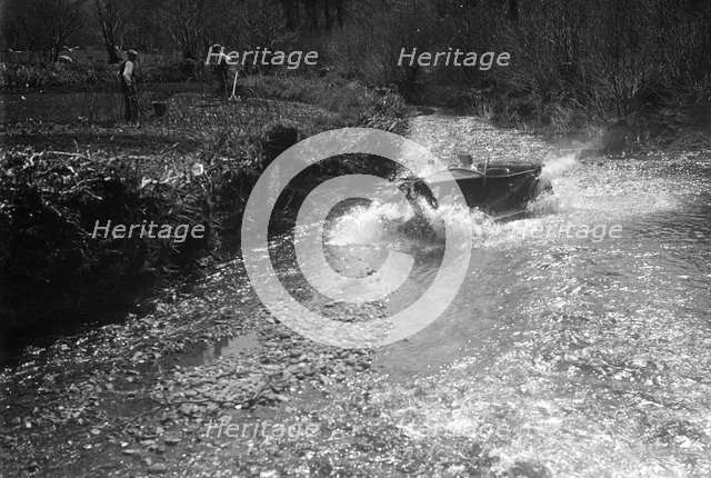 Kitty Brunell road testing a Riley 9 WD tourer, c1930. Artist: Bill Brunell.
