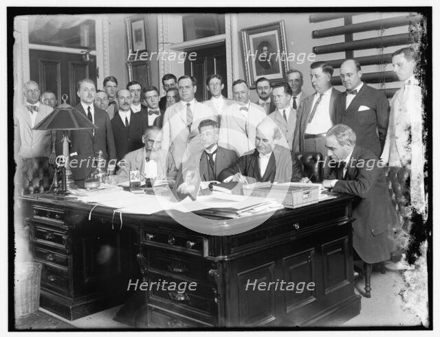 Group: includes William Jennings Bryan (at desk, 2nd from right)..., between 1910 and 1920. Creator: Harris & Ewing.