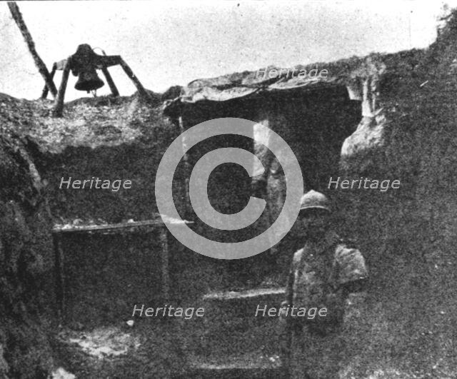 'Les Gaz Allemands; Cloche installee pres d'un abri de guetteur pour lui..., 1916. Creator: Unknown.