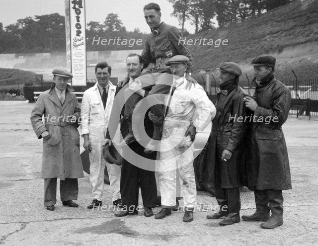 Leon Cushman being carried aloft after making a successful speed record attempt, Brooklands, 1931. Artist: Bill Brunell.