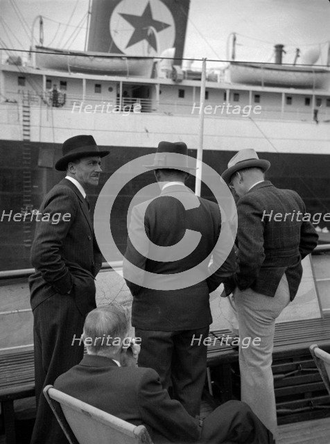 Businessmen on a ship in London docks, 1937. Artist: SW Rawlings