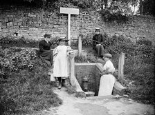 Collecting water from the village pump, Barton Hartshorn, Buckinghamshire, 1901. Artist: Alfred Newton & Sons.