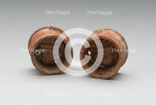 Pair of Ear Plugs with Face of Figure in Interior, A.D. 300/750 A.D. Creator: Unknown.