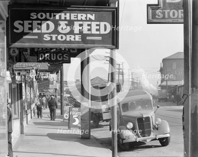 French market sidewalk scene, Waterfront in New Orleans, Louisiana, 1935. Creator: Walker Evans.