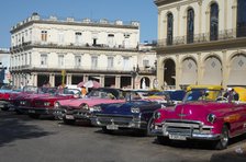 Selection of beautifully restored old American cars, alongside the Parque Central, Havana, Cuba,2024 Creator: Ethel Davies.