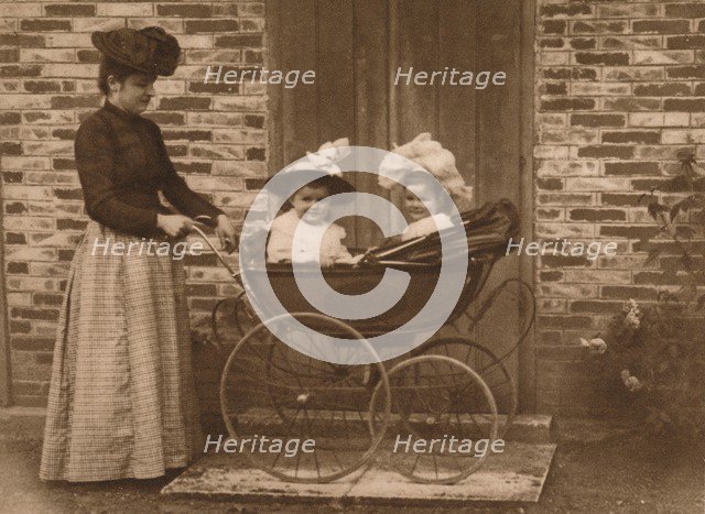 'Woman and children in a pushchair', 1937. Artist: Unknown.