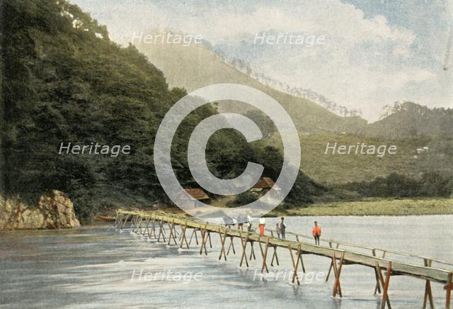 'Passerelle Sur La Riviere D'Arakawa', (Footbridge over the Arakawa River), 1900. Creator: Unknown.