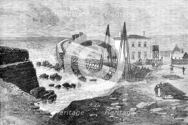 The Late Storms: breach in the sea wall on the strand at Youghal, Ireland, 1881. Creator: Unknown.