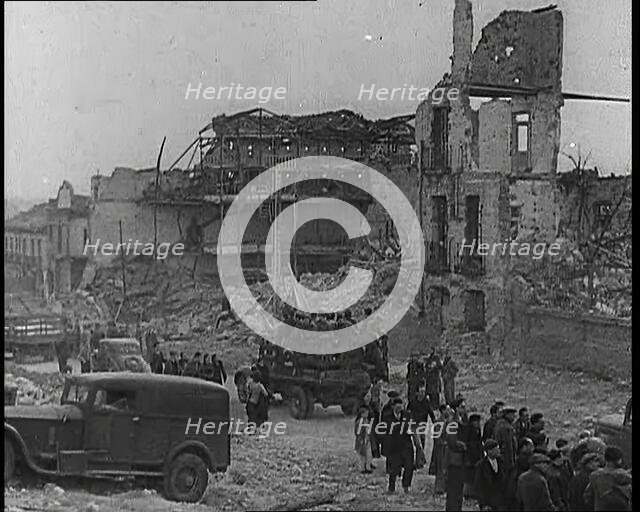 Lorries Carrying Spanish Nationalist Soldiers Loyal To Franco Through Madrid Past the..., 1939. Creator: British Pathe Ltd.