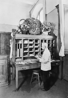 Postman sorting mail at the post office, Landskrona, Sweden, 1940. Artist: Unknown