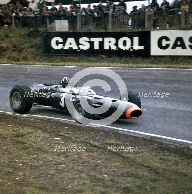Graham Hill racing a BRM P261, British Grand Prix, Brands Hatch, Kent, 1966. Artist: Unknown