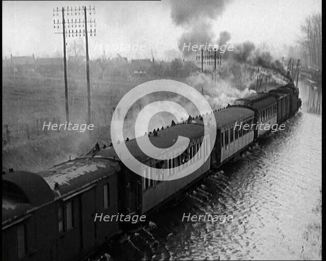 Train Driving Through Flooded Fields and Tracks, 1926. Creator: British Pathe Ltd.
