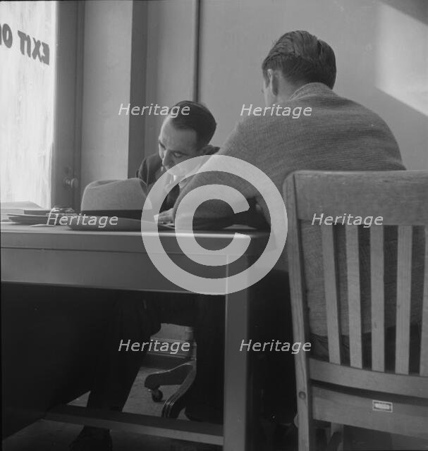 The interview for unemployment compensation, San Francisco, California, 1938. Creator: Dorothea Lange.