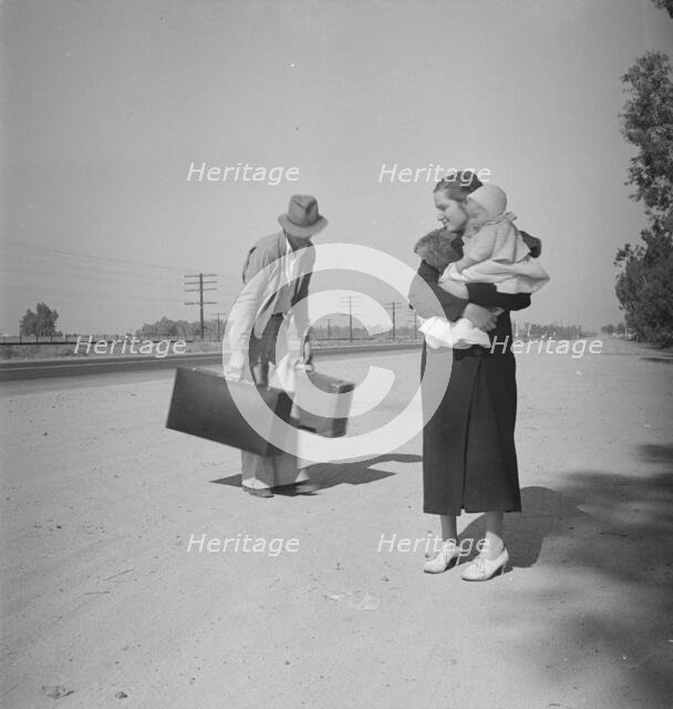 Young family, penniless, hitchhiking on U.S. Highway 99 in California, 1936. Creator: Dorothea Lange.