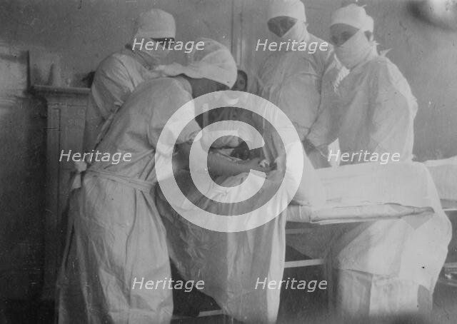 Cutting off a foot -- Canadian Hospital, Le Touquet, between 1914 and c1915. Creator: Bain News Service.