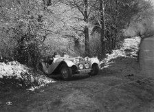 SS Jaguar 100 taking part in a motoring trial, late 1930s. Artist: Bill Brunell.