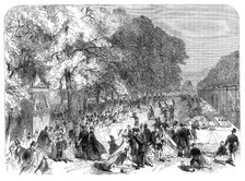 Fete given by the Prince Imperial to poor children of Paris in the Tuileries Gardens, 1864. Creator: Unknown.