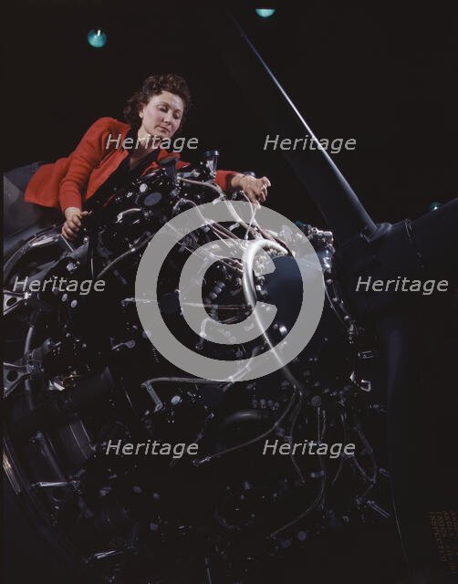 Woman at work on motor, Douglas Aircraft Company, Long Beach, Calif., 1942. Creator: Alfred T Palmer.