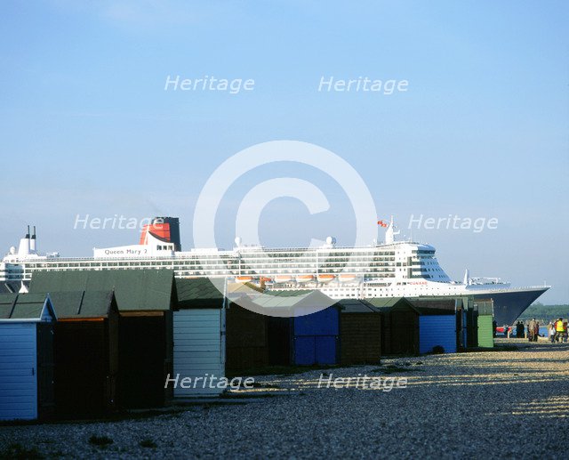 Queen Mary II sails past Beach Huts, Calshot May 2004. Artist: Unknown.