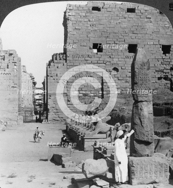 'Avenue of sacred images after excavation, Karnak, Thebes, Egypt', c1900. Artist: Underwood & Underwood