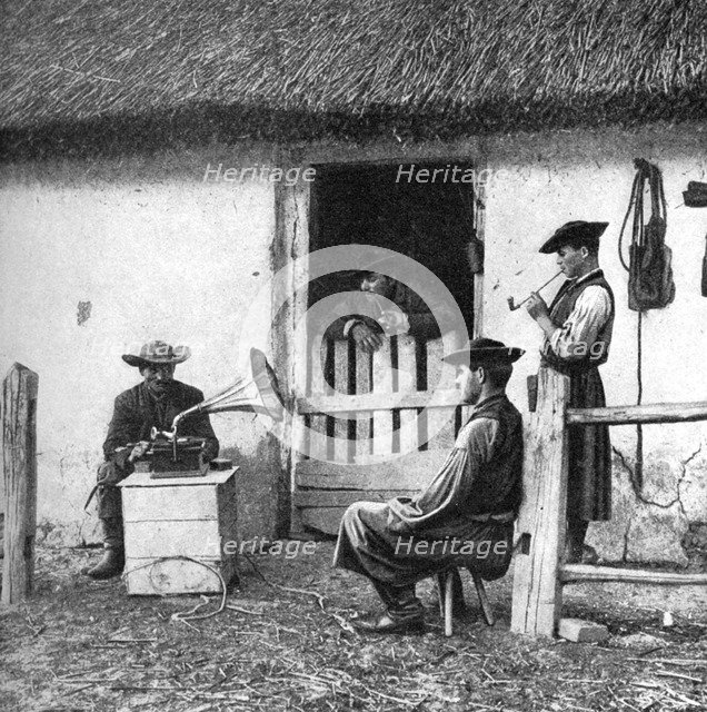 Leisure time for cowherds, Hungary, 1922.Artist: AW Cutler