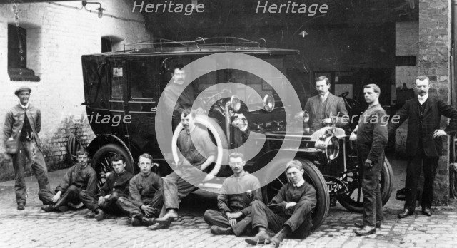 Men with a 1911 Daimler, c1911. Artist: Unknown