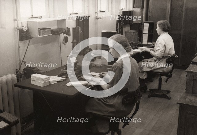 Two women at work in the wages office, Rowntree factory, York, Yorkshire, 1952. Artist: Unknown