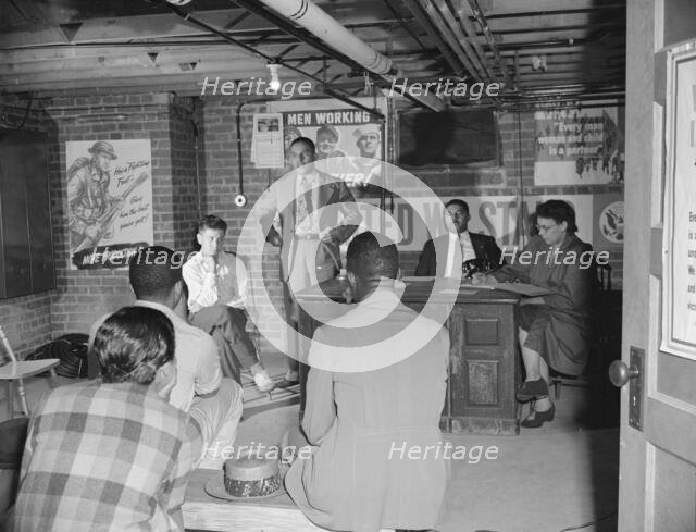 Air raid wardens' meeting in zone nine, Southwest area, Washington, D.C, 1942. Creator: Gordon Parks.