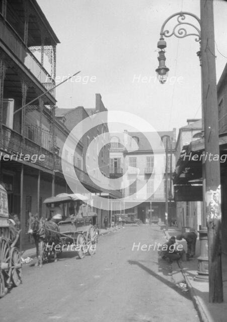 View down a street, New Orleans or Charleston, South Carolina, between 1920 and 1926. Creator: Arnold Genthe.