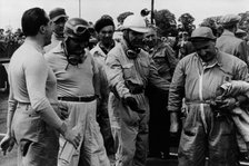 Alberto Ascari, Froilan Gonzalez, Guiseppe Farina (from left to right), and a mechanic. Artist: Unknown