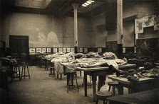The interior of a dissecting room in Edinburgh, with half-covered cadavers on benches, 1889. Creator: Unknown.