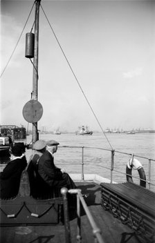 A view of shipping near Gravesend, Kent, from the stern of a passenger ferry, c1945-c1965. Artist: SW Rawlings