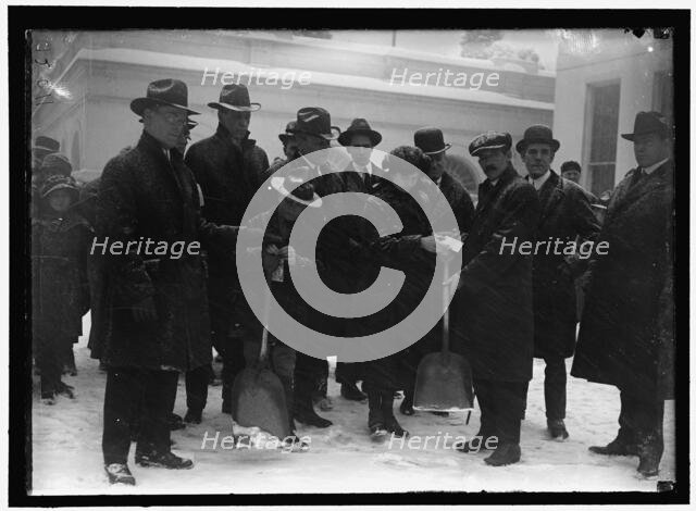 Group outside White House in snow, between 1913 and 1918. Creator: Harris & Ewing.
