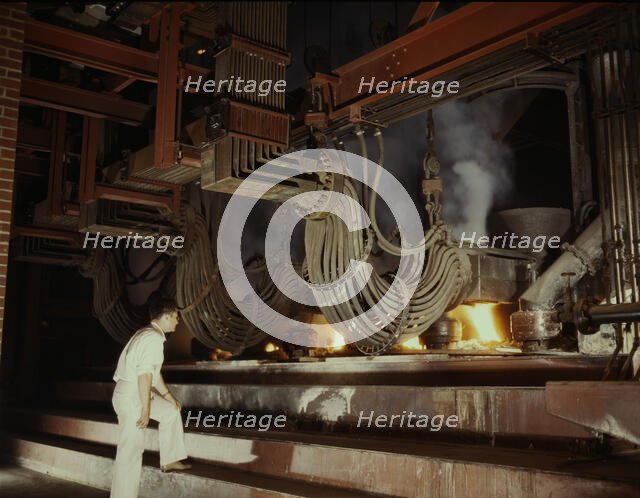 A large electric phosphate smelting furnace used in the making...Muscle Shoals area, Alabama, 1942. Creator: Alfred T Palmer.