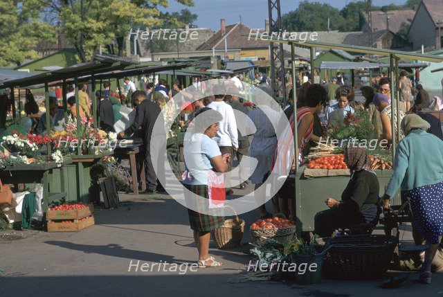 Morning market in a town in Hungary. Artist: CM Dixon Artist: Unknown