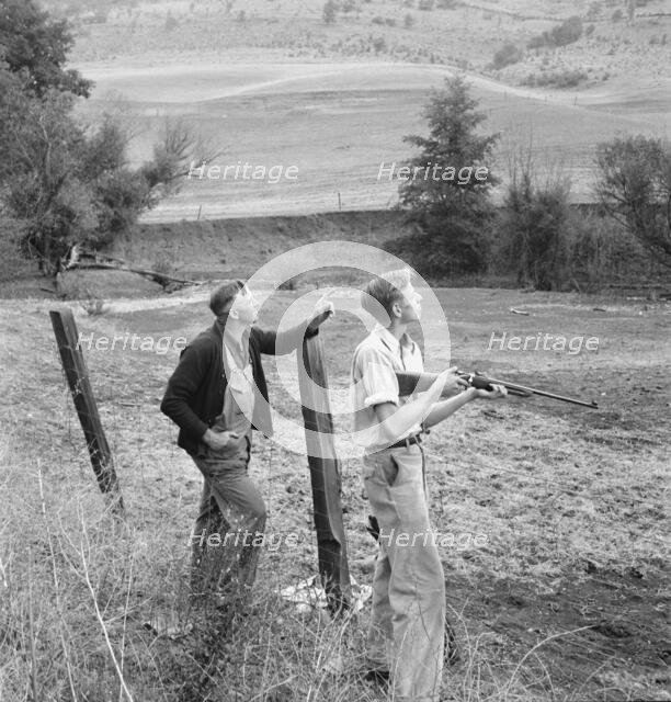Farmer and boy in the fall of the year at the time the hunting..., Jackson County, Oregon, 1939. Creator: Dorothea Lange.