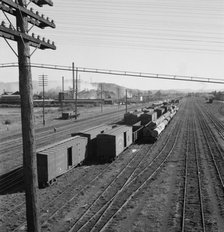 Railroad yard, looking down from highway bridge, Centralia, Lewis County, Washington, 1939. Creator: Dorothea Lange.