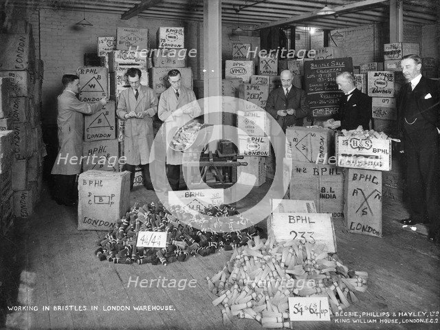 Working with bristles in a warehouse, London, 1938. Artist: Unknown