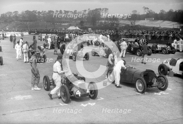 Cars on the starting grid for the JCC International Trophy, Brooklands, 2 May 1936. Artist: Bill Brunell.