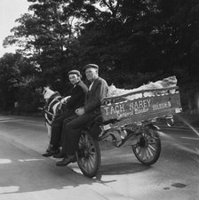 Two men seated on a horse and cart on a road, West Yorkshire, 1966-1974. Creator: Eileen Deste.