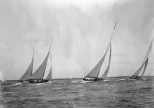 A group of 12 Metres sailing yachts racing on windward leg in good wind, 1933. Creator: Kirk & Sons of Cowes.