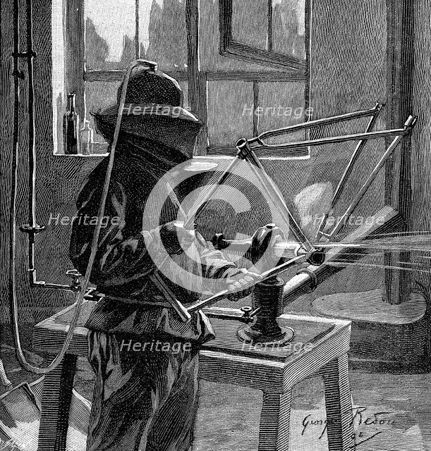 Sandblasting the joints of a bicycle frame, France, 1896. Artist: Unknown