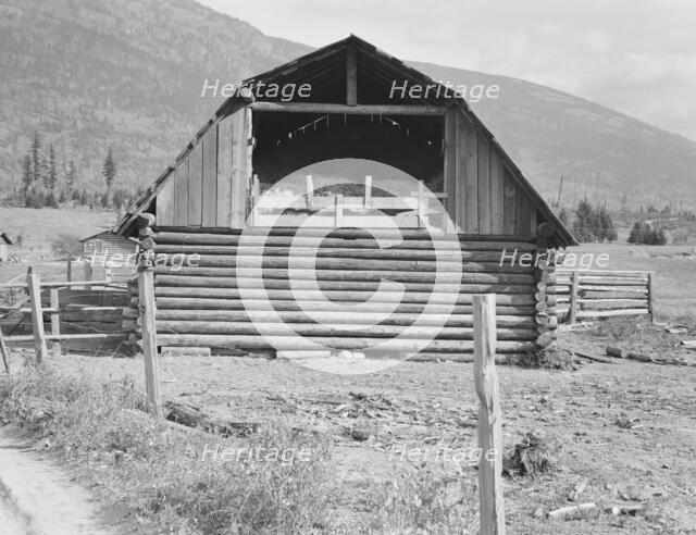 Log barn, FSA borrower plans to develop dairy ranch, Boundary County, Idaho, 1939. Creator: Dorothea Lange.