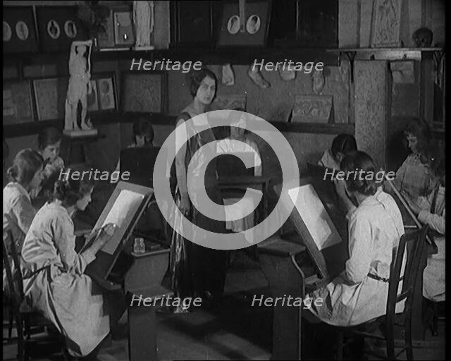 Young Female Civilian Wearing a Long Dress Posing for an All Female Arts Class, 1920. Creator: British Pathe Ltd.