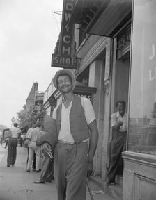 Panhandler on 7th Street, N.W., Washington, D.C., 1942. Creator: Gordon Parks.