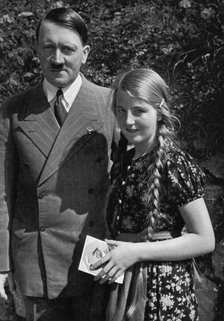 A young girl asks Adolf Hitler for his autograph, 1936. Artist: Unknown