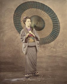 Japanese woman holding a large parasol, 1868-1880. Creator: Felice Beato.