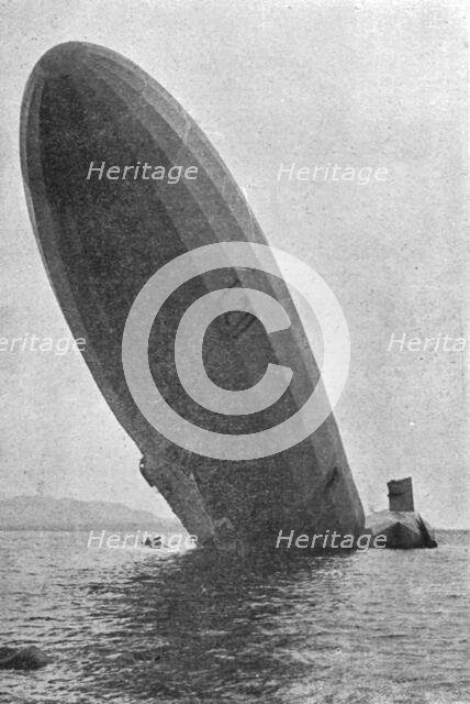'Trois Zeppelins detruits en trois jours. Le "L20" dans un fjord de Norvege; L'avant dresse..., 1916 Creator: Unknown.