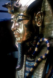 Gold mask of Tutankhamun on the second coffin. Artist: Unknown
