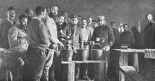 'Les camps de represailles; les repas: la soupe, apportee dans des seaux de toilette, etait..., 1916 Creator: Unknown.
